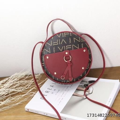 Black and red stitching letter small round bag