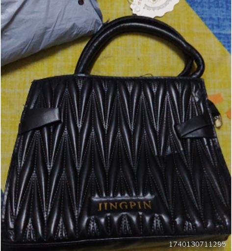 Black striped handbag